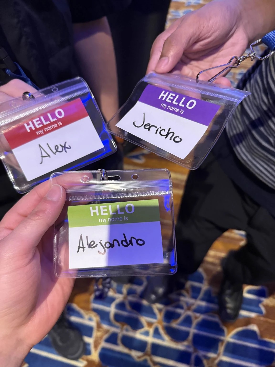 Alex, Jericho and Alejandro holding up their name badges